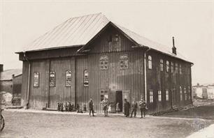 Synagogue after rebuilt. Near the building is full of kids, and random passers look with interest at the photographer