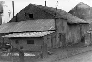 Beit-Midrash. In the background is a synagogue, 1992