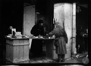 Austrian soldier buys goods in a Jewish store Austrian soldier buys goods in a Jewish store