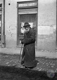 Old Jew in front of the store Old Jew in front of the store