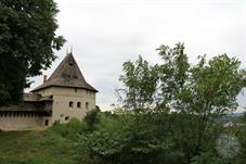 There are castle ruins on a high hill above the city.