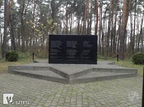 Memorial on the mass grave in the forest near the town