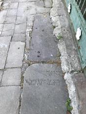 Tombstones from Old cemetery used in the pavement Tombstones from Old cemetery used in the pavement