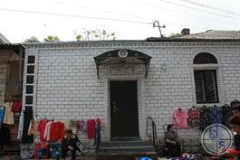 This modern synagogue, as can be seen next to the market This modern synagogue, as can be seen next to the market